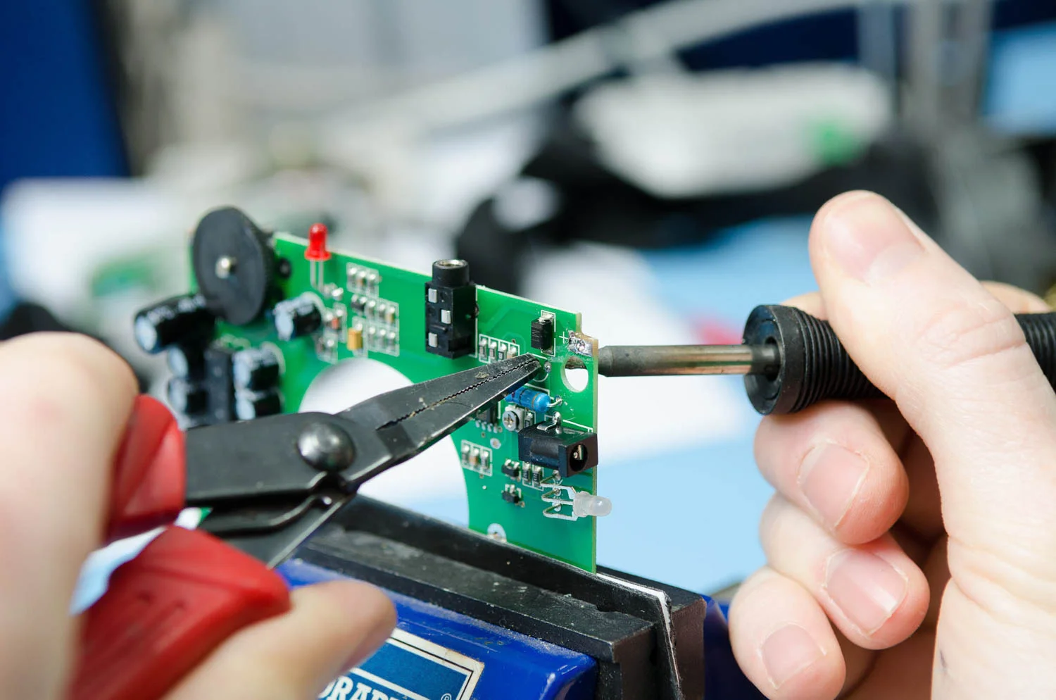 close up on circuit board being worked on