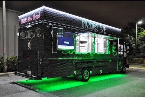  Photo:  Food truck at night with neon accent lighting.  