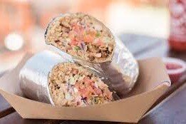  Photo:  Slightly out of focus photo of a burrito sliced in half.  It looks boring and unappealing.  