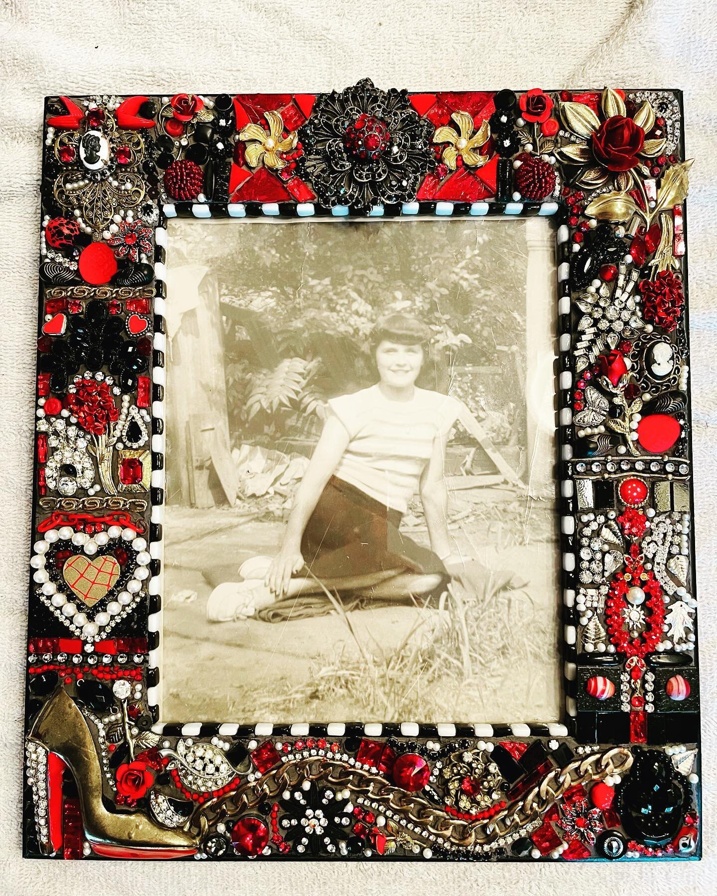 I made this jeweled frame for our nephew to celebrate his grandmother. The photo is her at age 15 but as an adult she was quite the Italian glamour girl. She loved red roses and red lipstick, diamonds and high heels. I&rsquo;m told this frame was so 