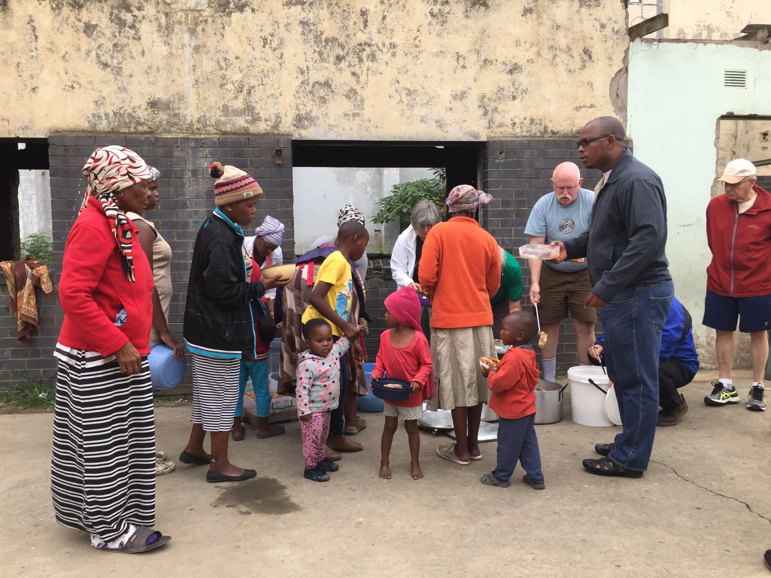 AIAIA food parcels help to feed families amidst the squalor of Sowetho