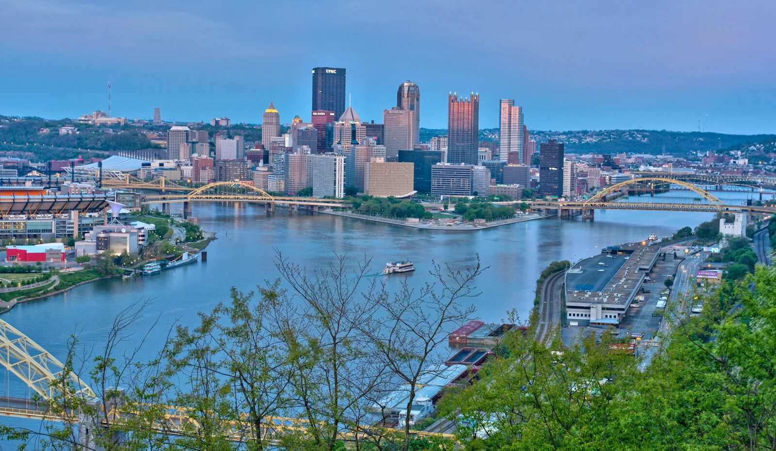 A ferry boat cruising the Ohio River just after sunrise