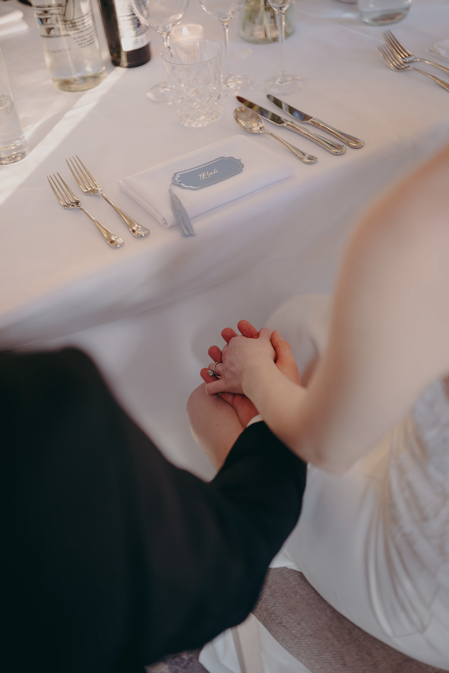 Wedding Tablescape Featuring Powder Blue Tassel and Silver Foil Wavy Arch Shaped Place Settings