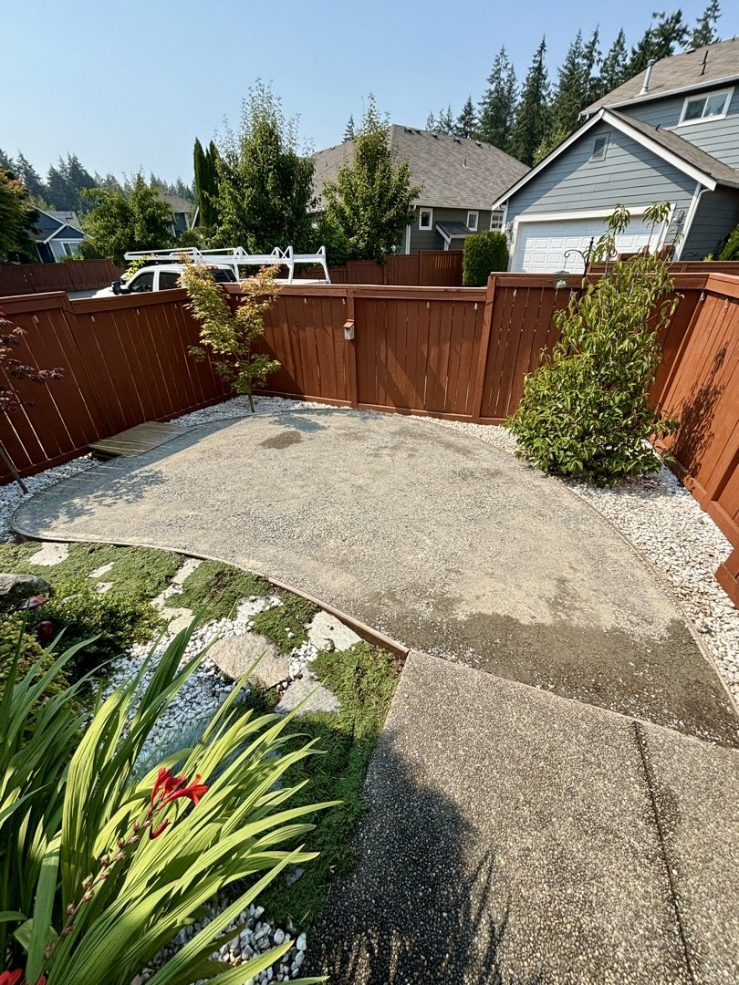 Compacted 5/8 inch minus crushed rock base in a backyard, base preparation for pet turf drainage before turf install