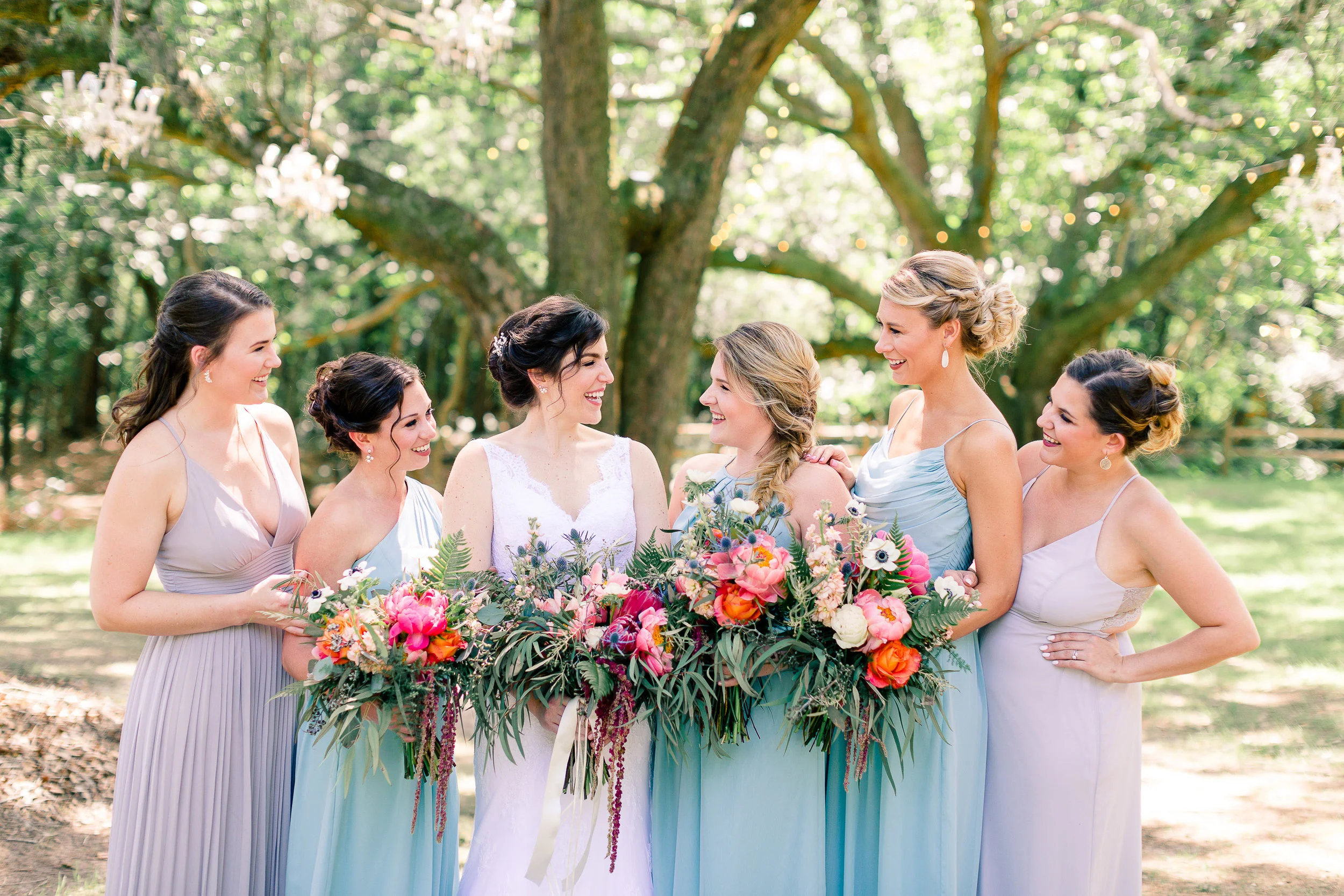 A bride and her bridesmaids photographed after their hair and makeup session