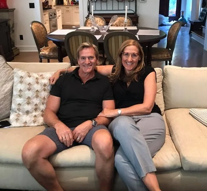 Pam Sherman with Joseph Nardone on the newly reupholstered couch