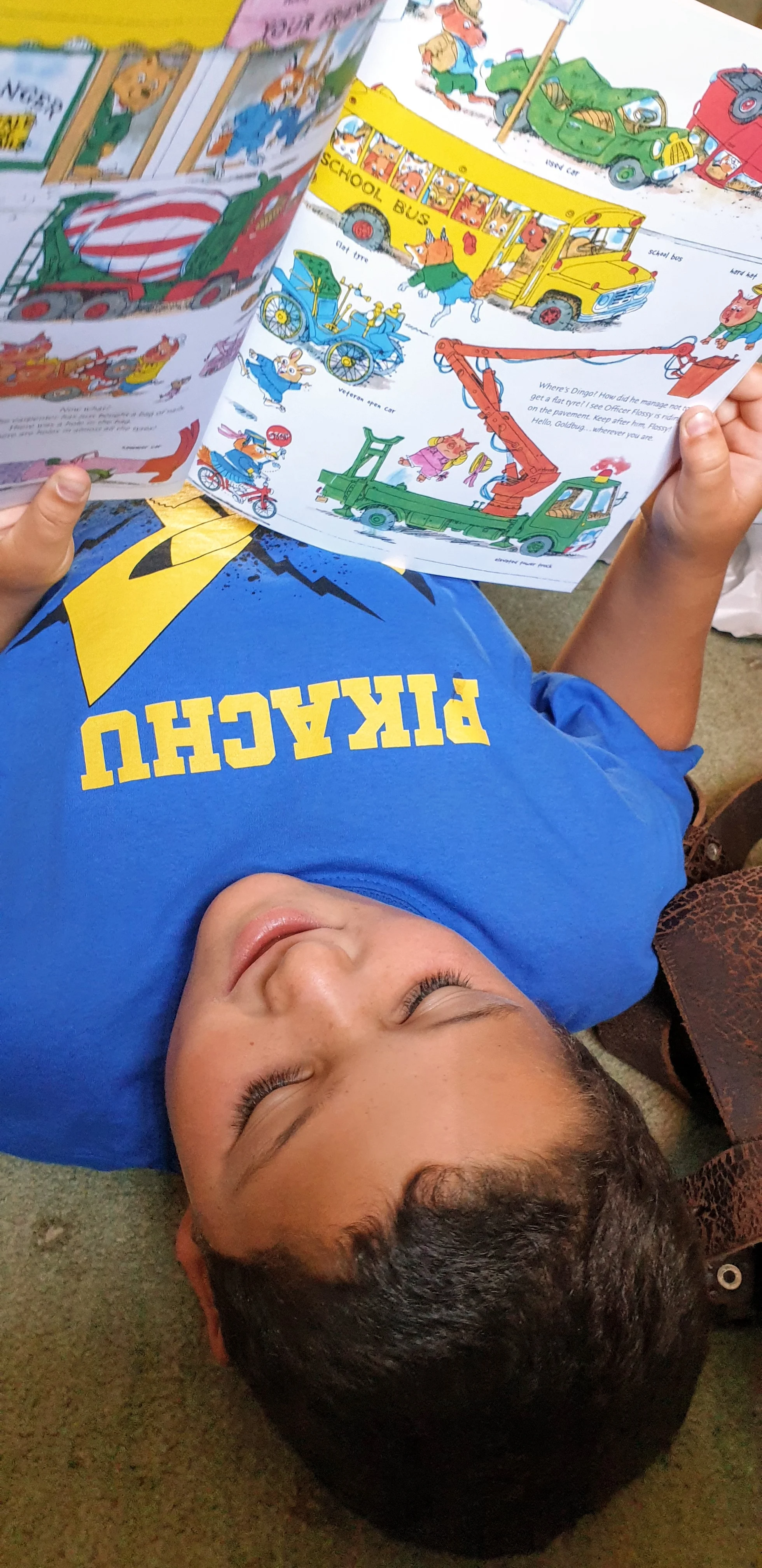 Isaac enjoying Richard Scarry’s Cars and Trucks and Things That Go . Photo © 2019 by Tim Warnes