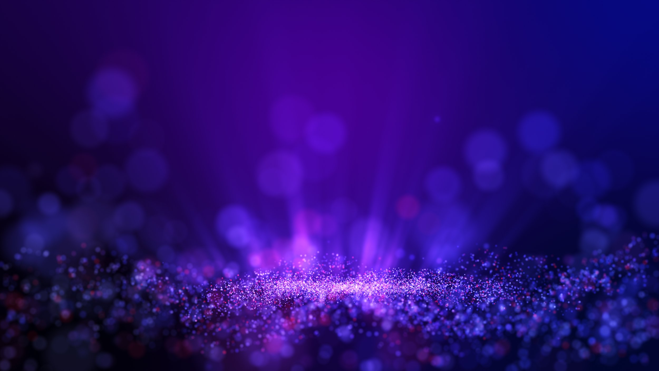 Abstract purple and blue glowing particles and light rays in a digital or space background.