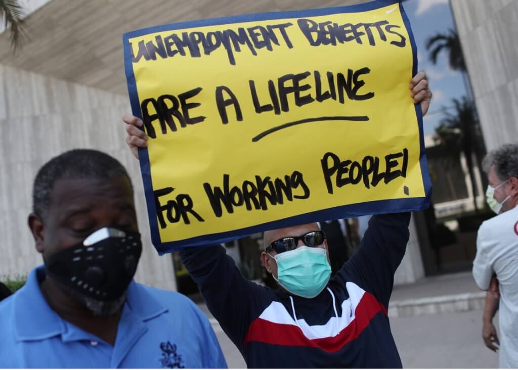 Jobless workers demonstrate in Miami Springs in support of continued federal unemployment benefits in the pandemic economy. (Joe Raedle/Getty Images)