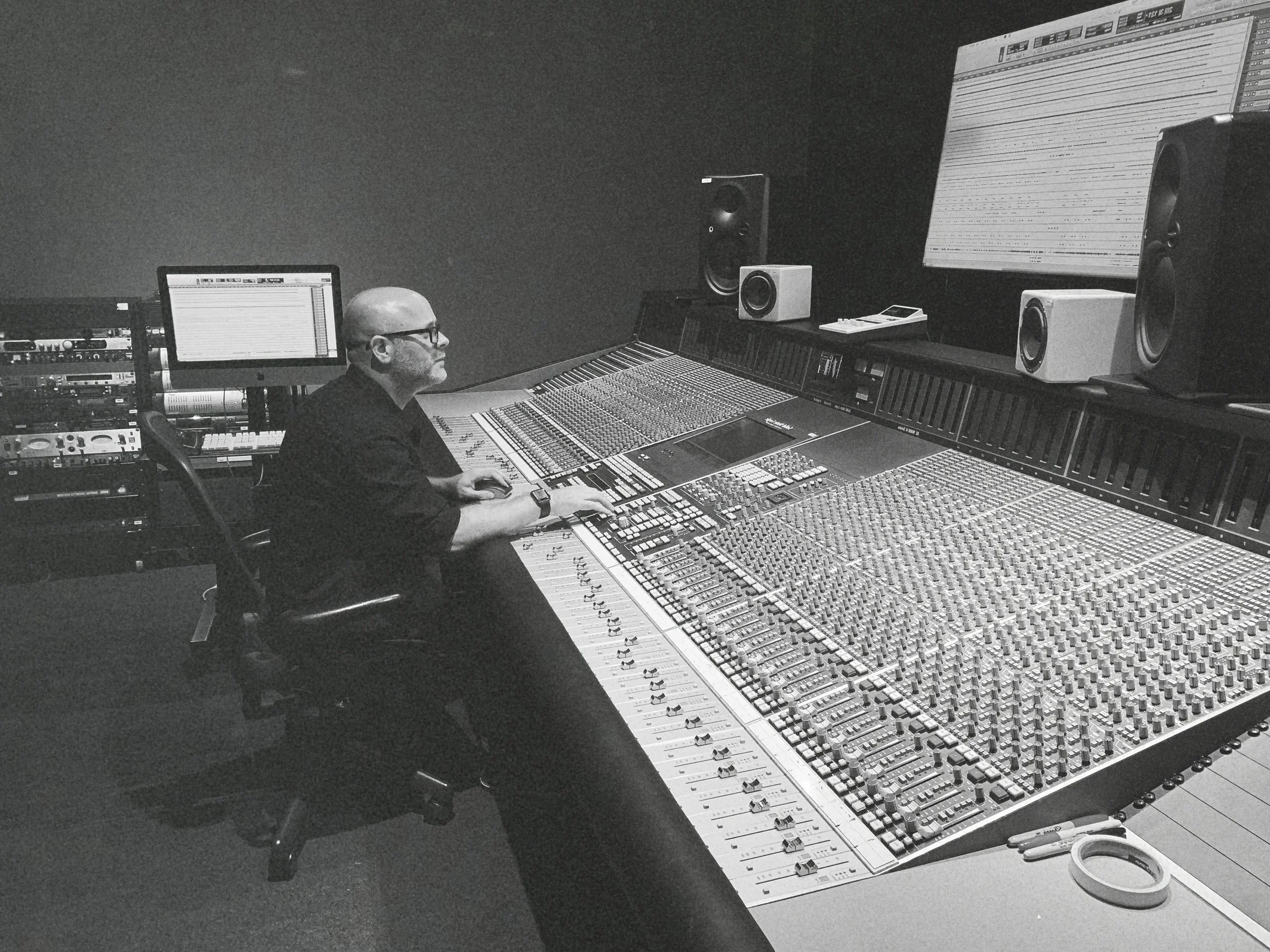 Ambrus Deak working at a large-format mixing console