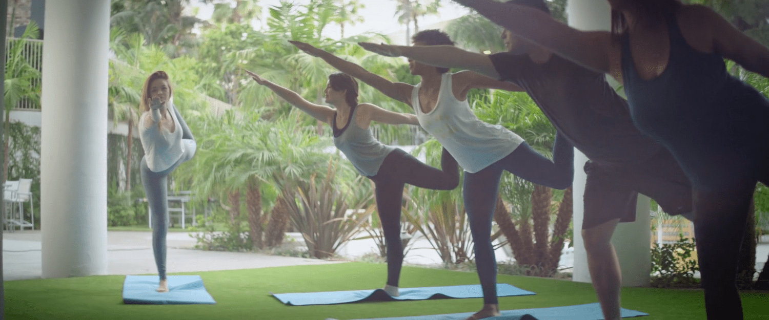 Guests in a group yoga session outdoors