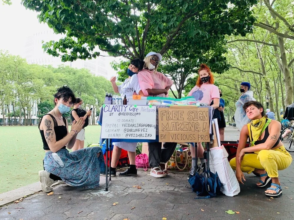 Vie with volunteers for the Care Network at the No More Tears for Black Queers March during New York Pride 2020