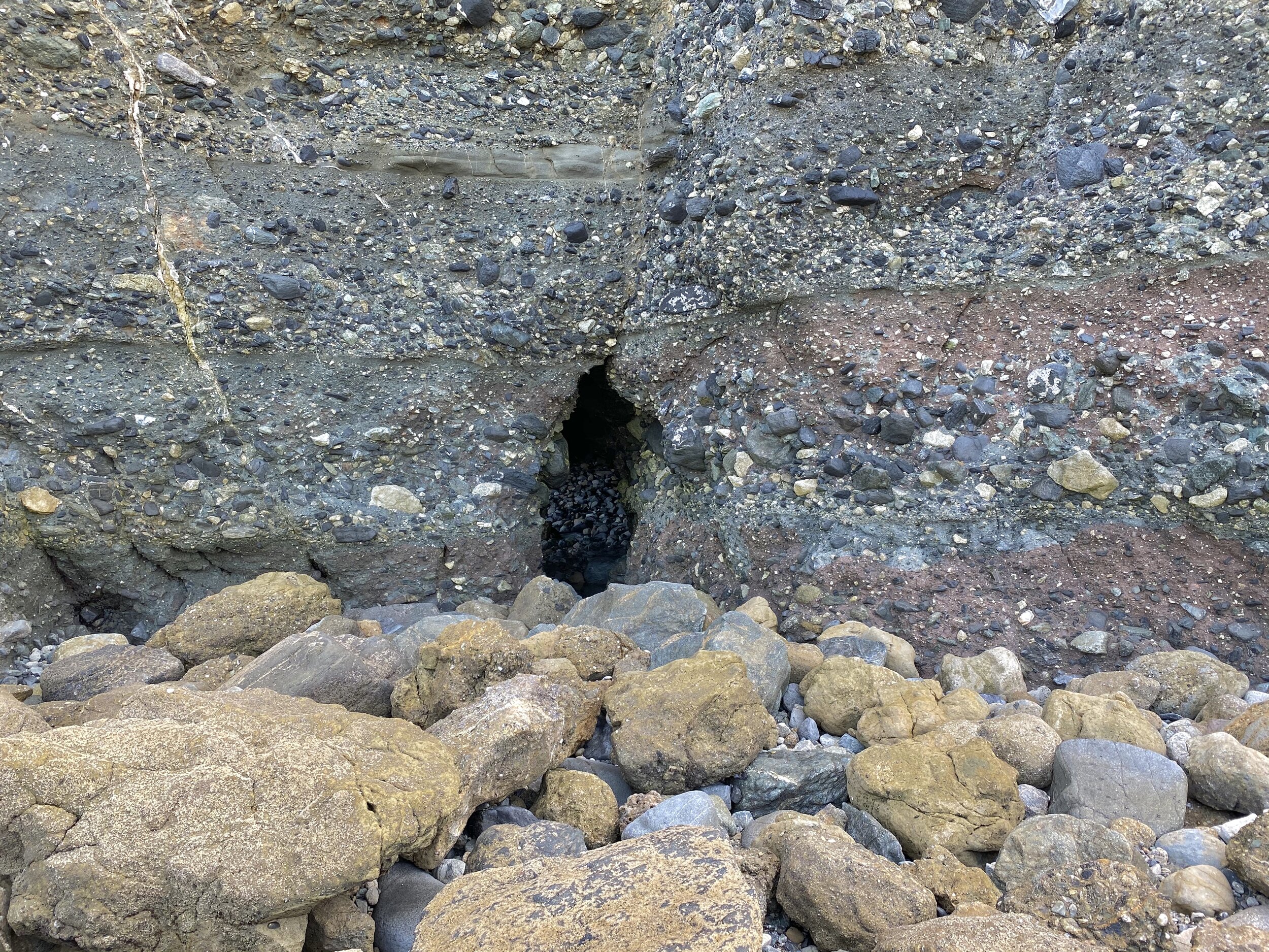 YOU'LL SEE THE SMALL OPENING TO THE CAVE