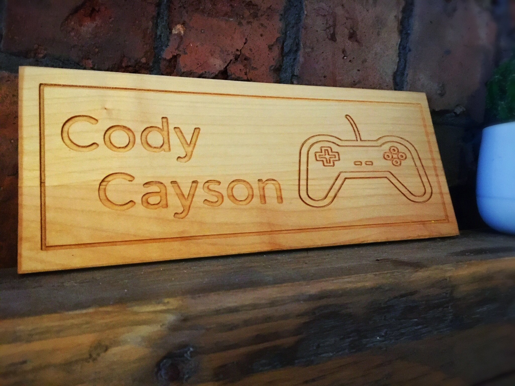 It can be frustrating to have a name that simply cannot be purchased ‘off the shelf.’ Arran and I know this all too well.  We have helped so many people to create beautiful personalised gifts for their friends and family with unusual names, just like Cody and Cayson’s Nanna, who asked us to create a solid beech door sign for her grandson’s Games Room.