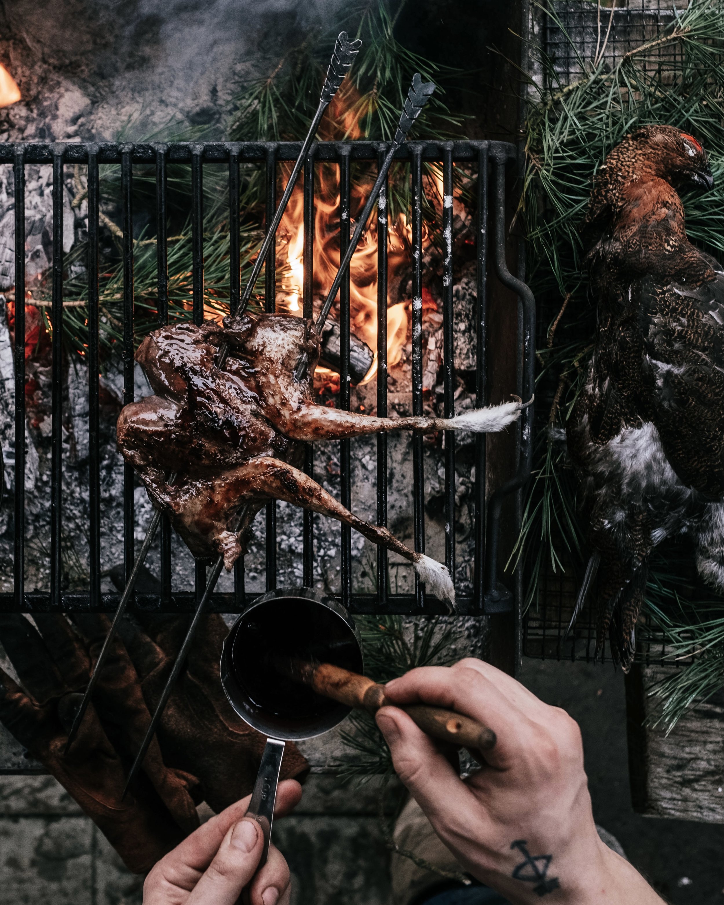 grouse-roasting-over-open-fire-fire-and-wild.jpg