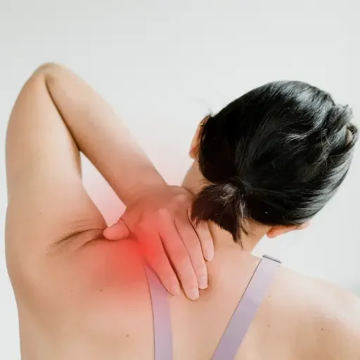 Woman holding neck in pain, representing treatment options from Midwest City pain management doctor.