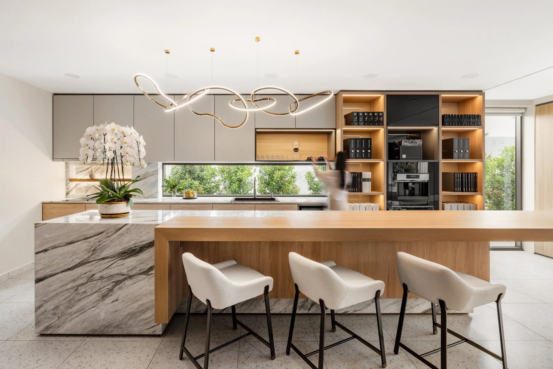  Instead of spices, condiments and cookbooks, the kitchen cabinets are full of wallcovering sample books.  