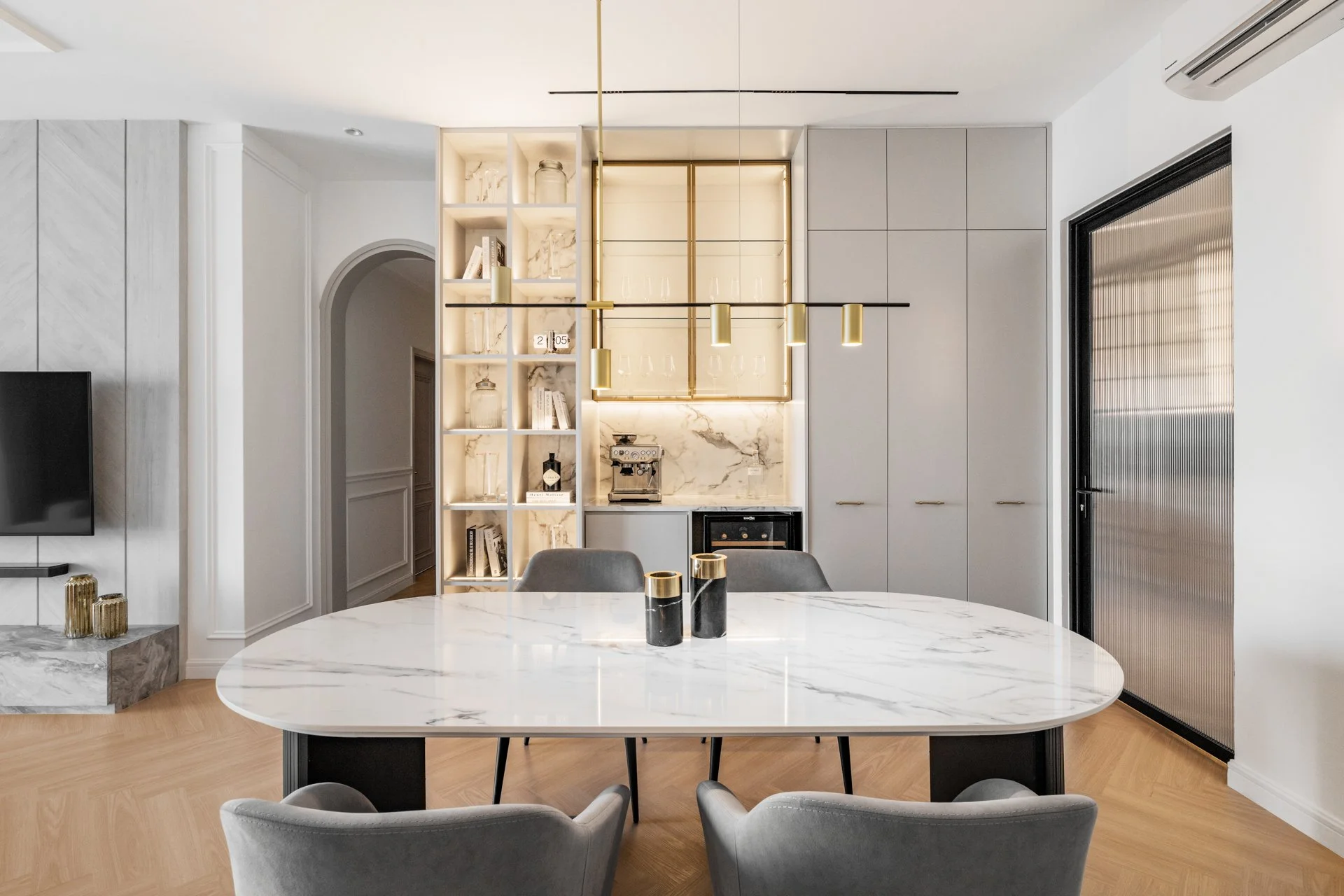  The light palette applied throughout makes this condominium space appear larger than it is. 