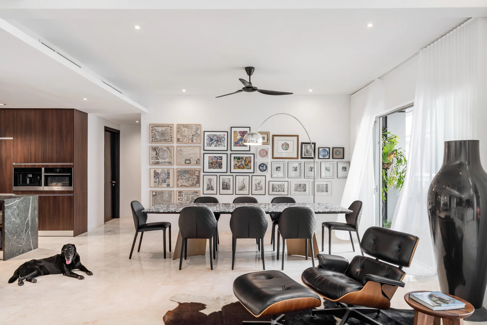  It's a blustery morning at James Yong's Kuala Lumpur duplex. The white curtains in the dining area are billowing, and the fronds of the staghorn ferns at the balcony sway gently with the wind. His elderly dog, River, settles into his usual spot by t
