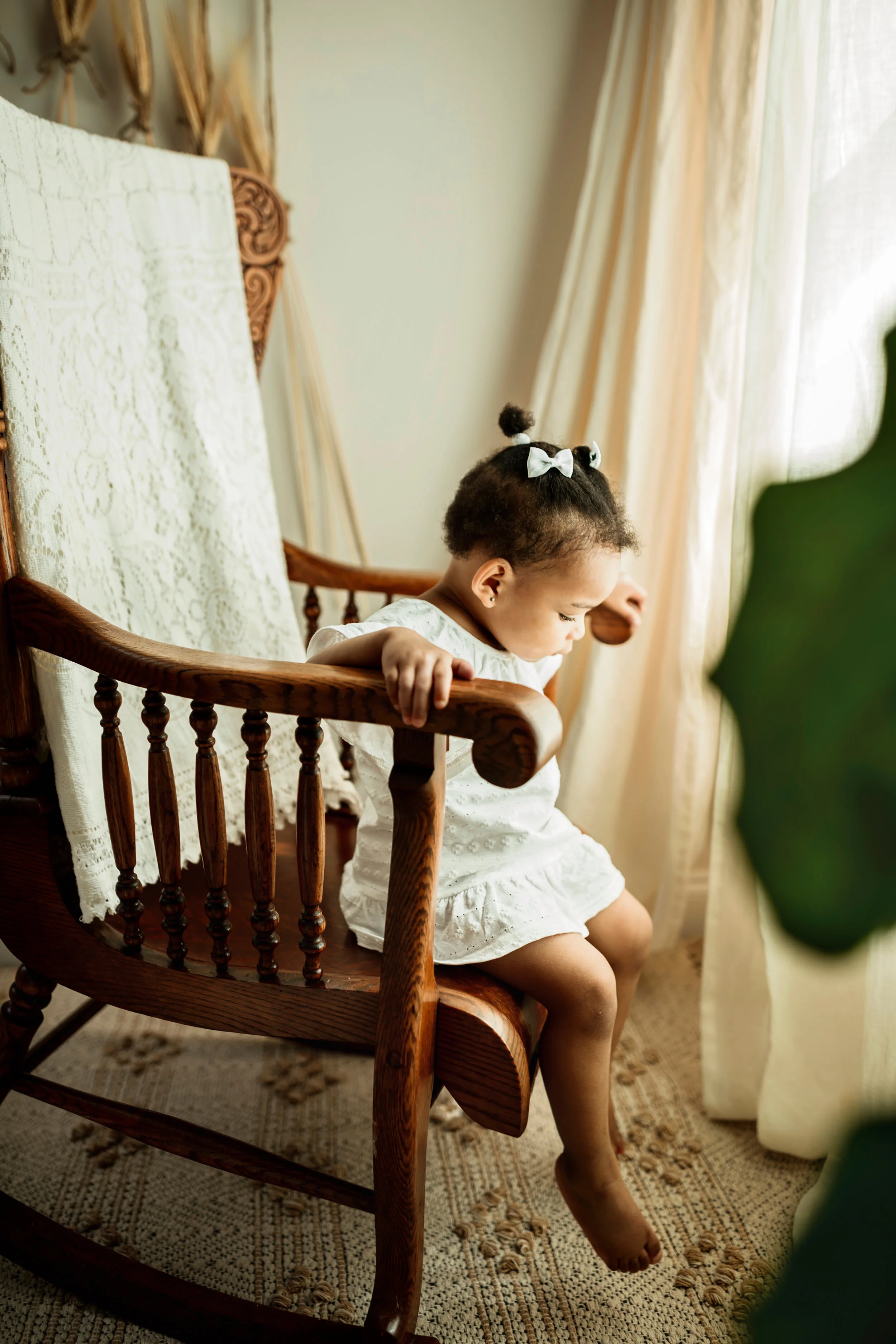 Montgomery Alabama Photographer - A little girl sits in a rocking chair in Pike Road, Alabama