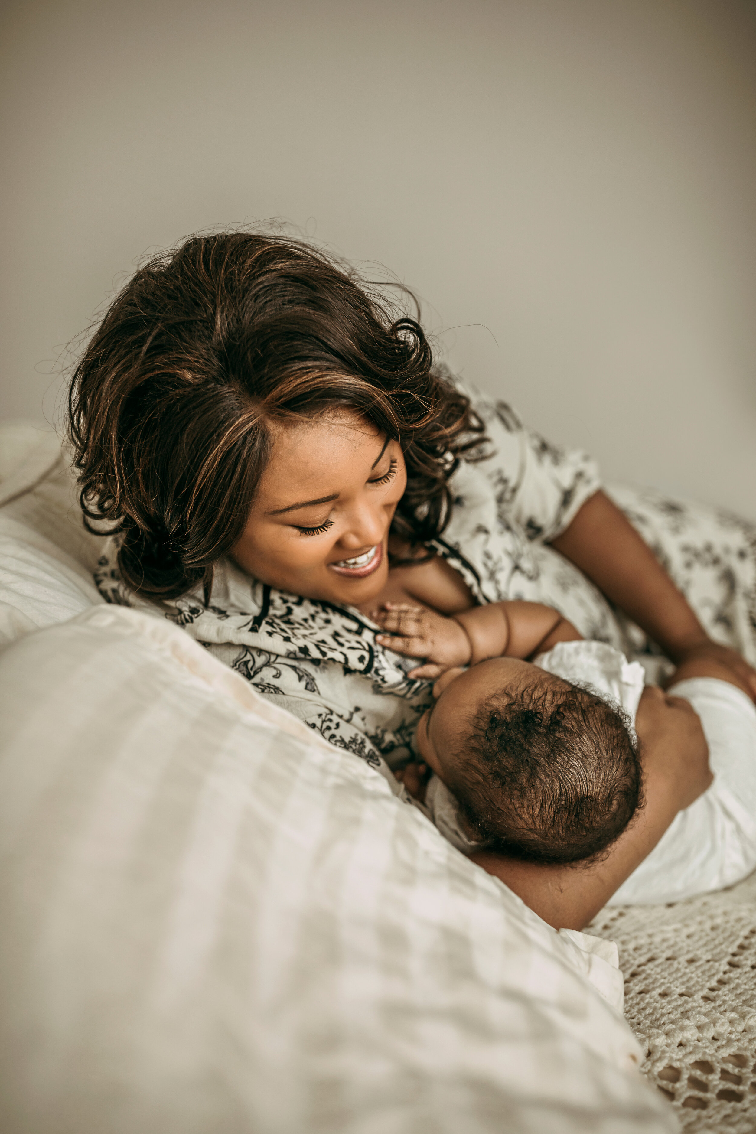 Montgomery Alabama Photographer - a mother smiles down at her nursing daughter in Pike Road, Alabama