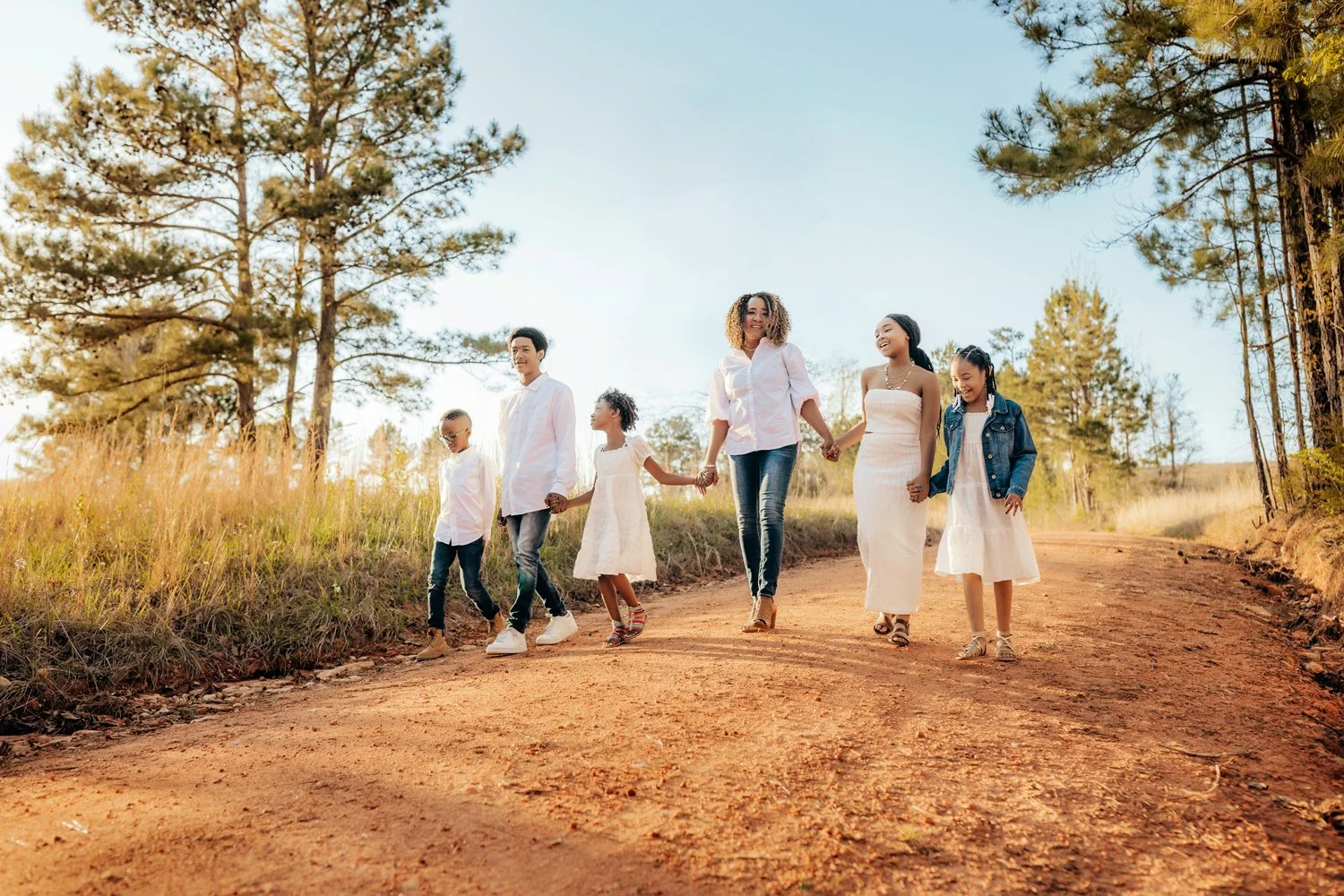 A grandmother walks with her grandchildren near Lake Martin, Alabama during a photo session with Montgomery Photographer m.Clemm photography