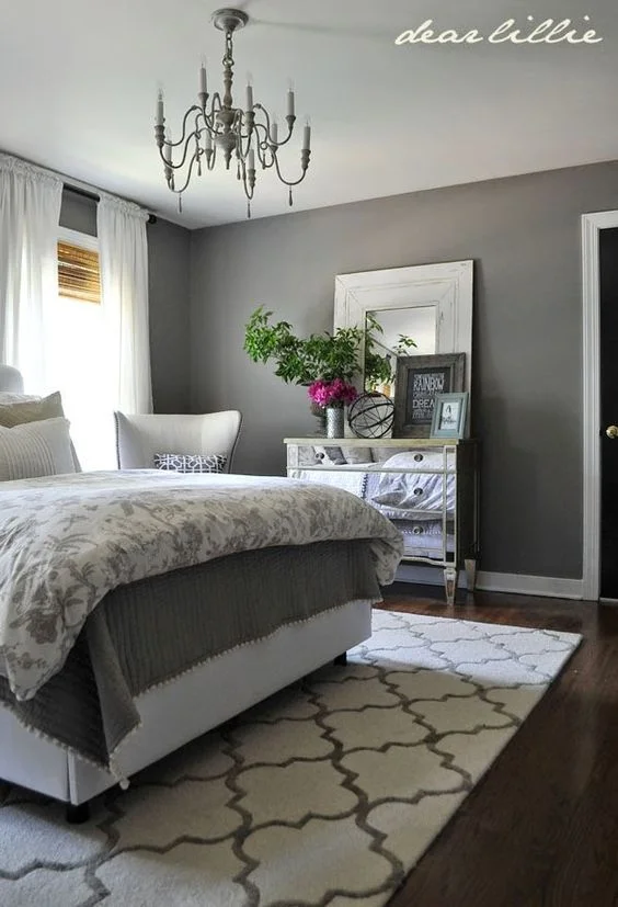 What a beautiful bedroom 🙂 The mirrored dresser adds a nice touch of Lux!