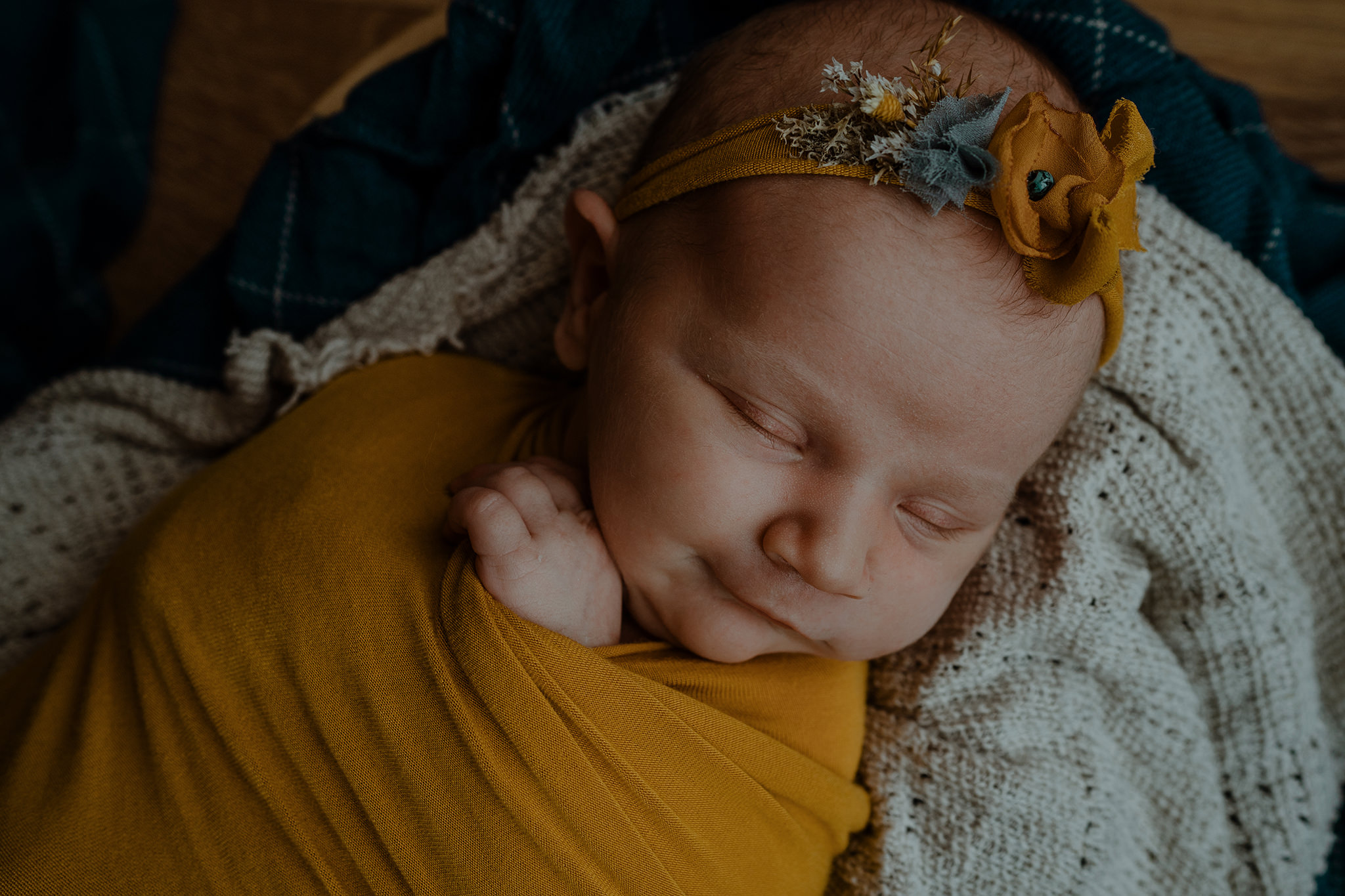 smiling newborn baby girl yellow headband Newborn Photographer Belfast