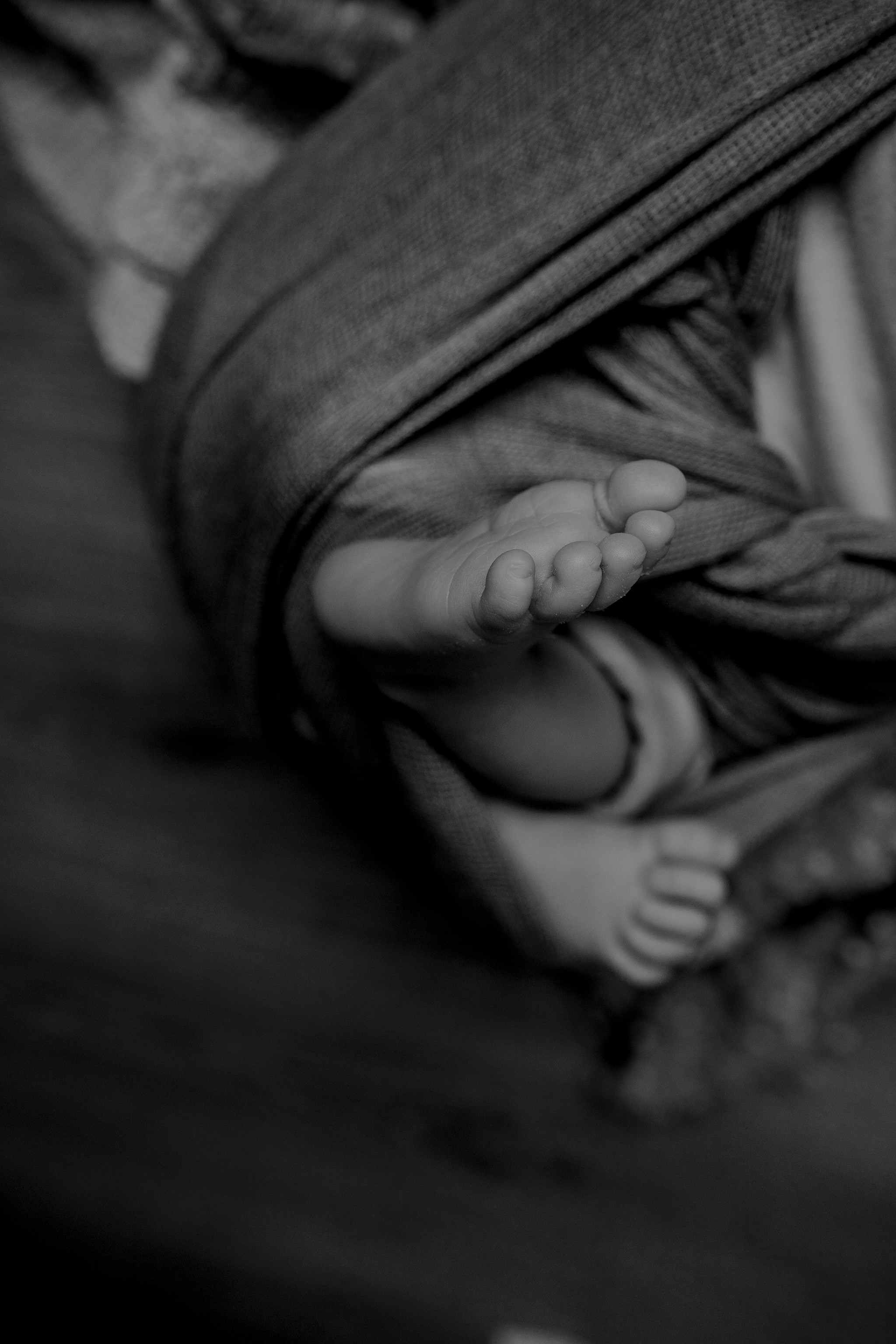 close up details baby boy feet in home newborn photographer Belfast