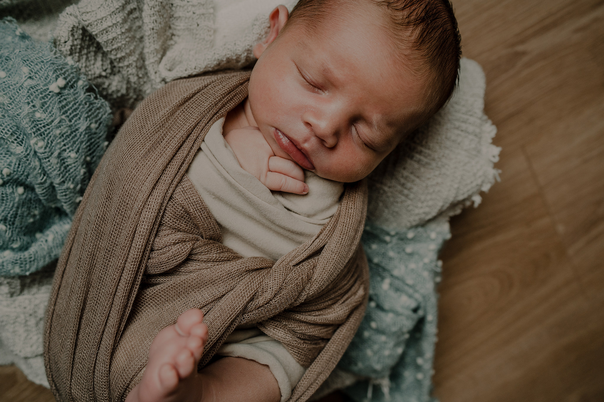 baby boy stone blue and neutral wraps in home newborn photographer Belfast