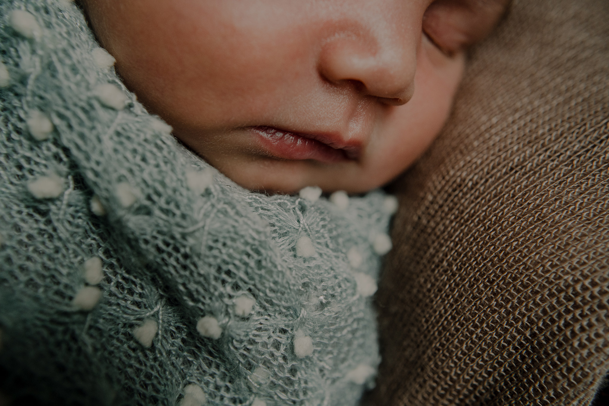 close up details baby boy face mouth in home newborn photographer Belfast