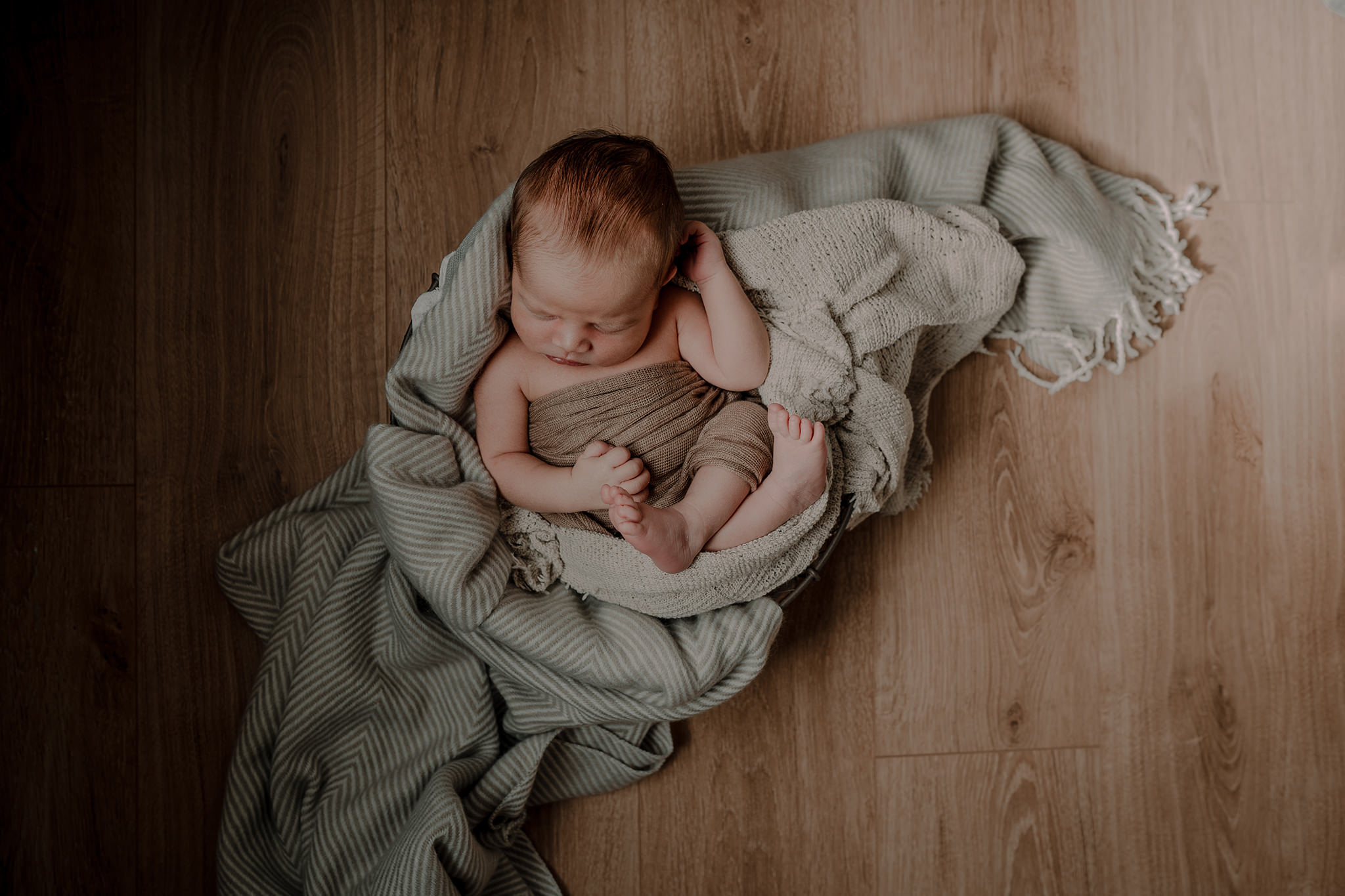 neutral tones blankets baby boy in home newborn photographer Belfast