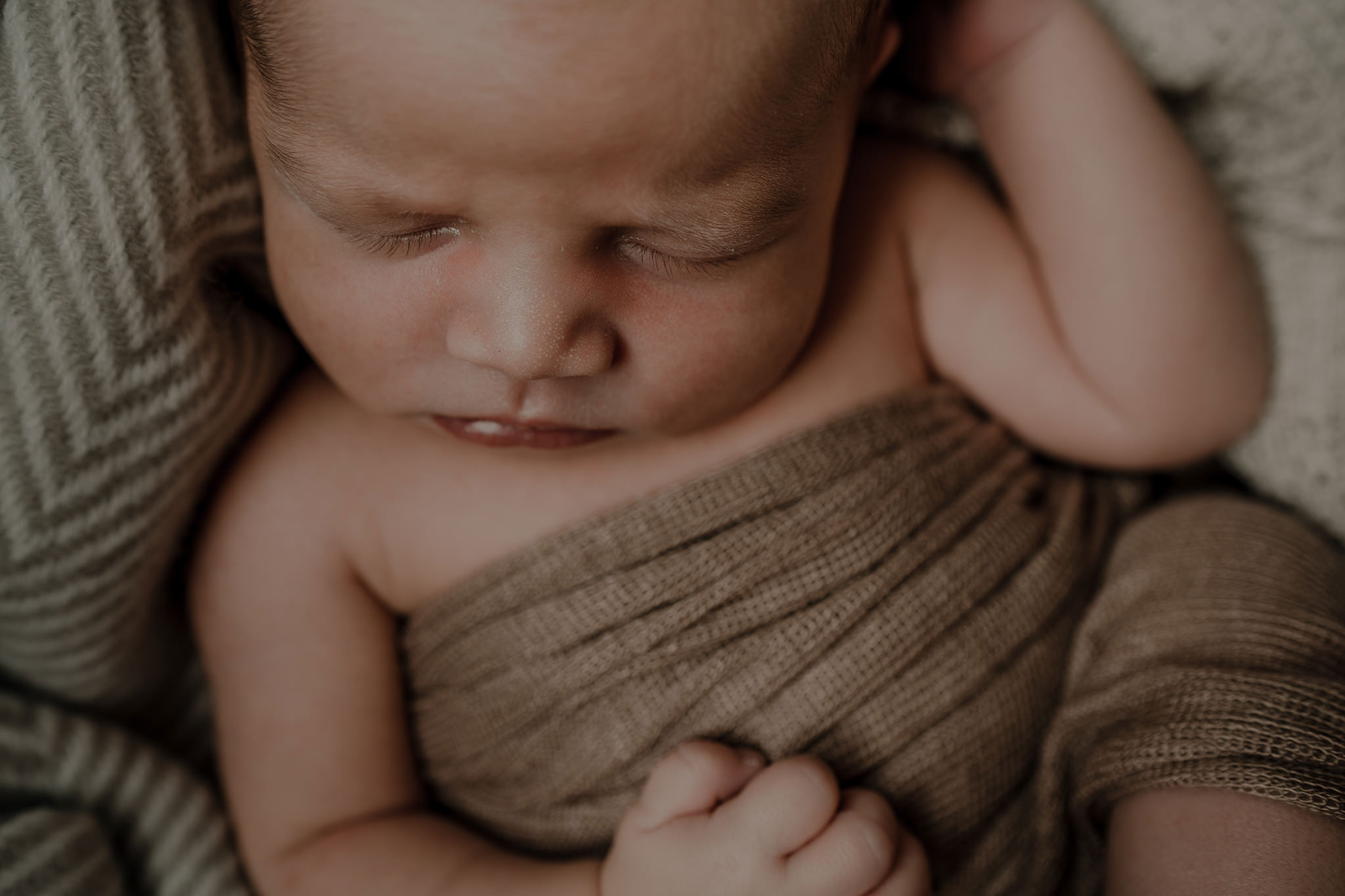 neutral tones blankets sleeping baby boy in home newborn photographer Belfast