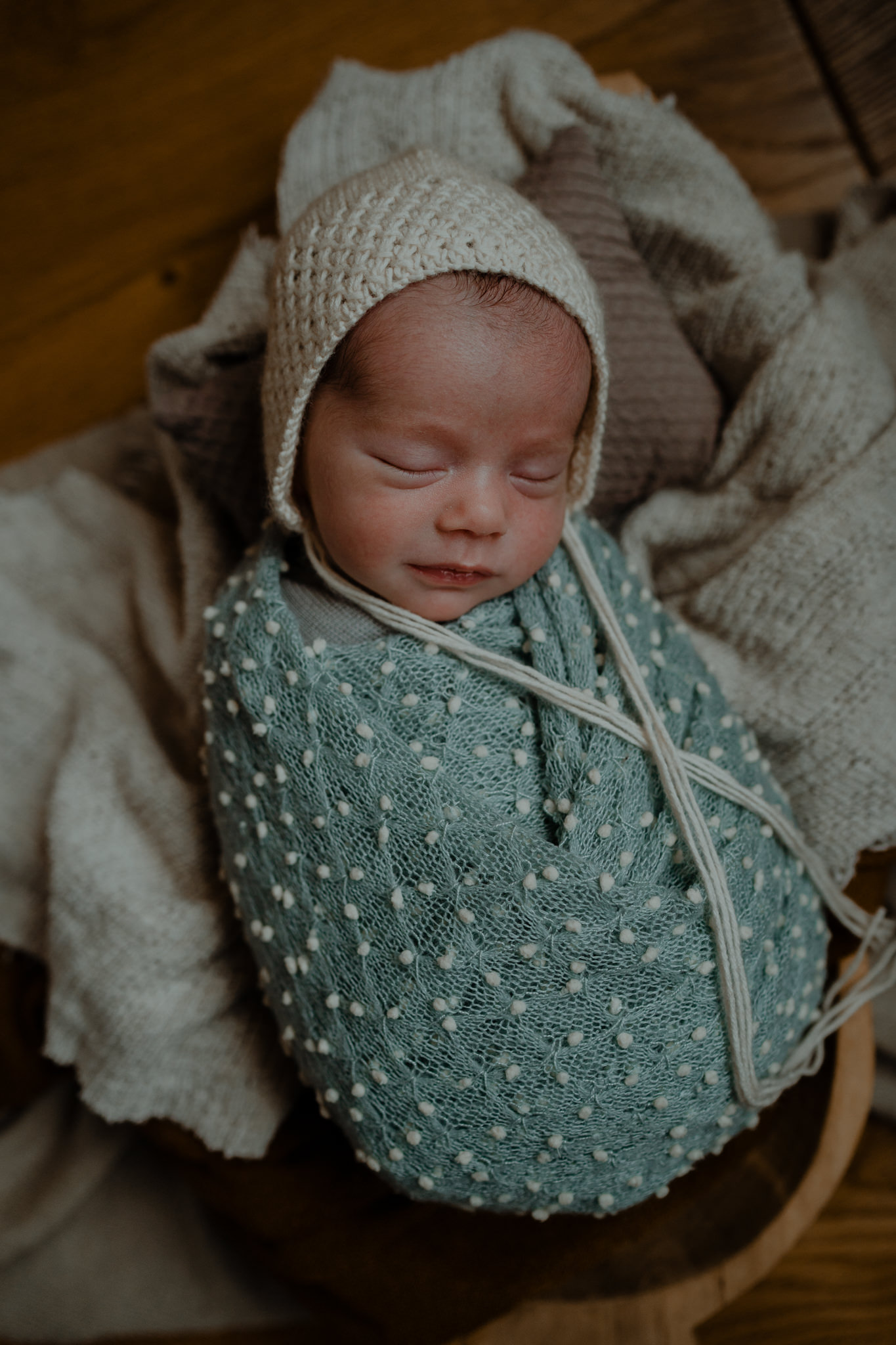 cute baby boy cream bonnet blue wrap creative newborn photographer Belfast