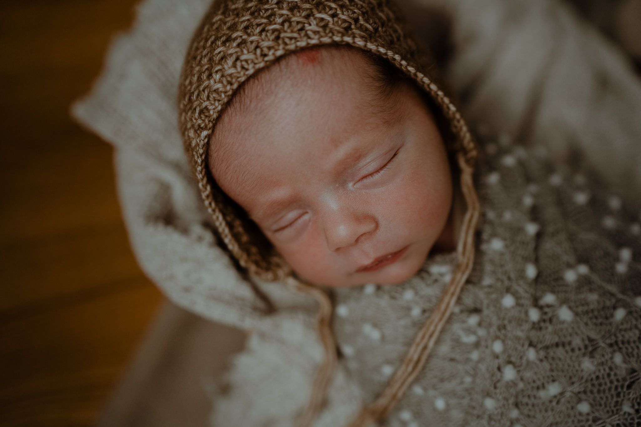 neutral bonnet grey wrap in-home creative newborn photographer Belfast