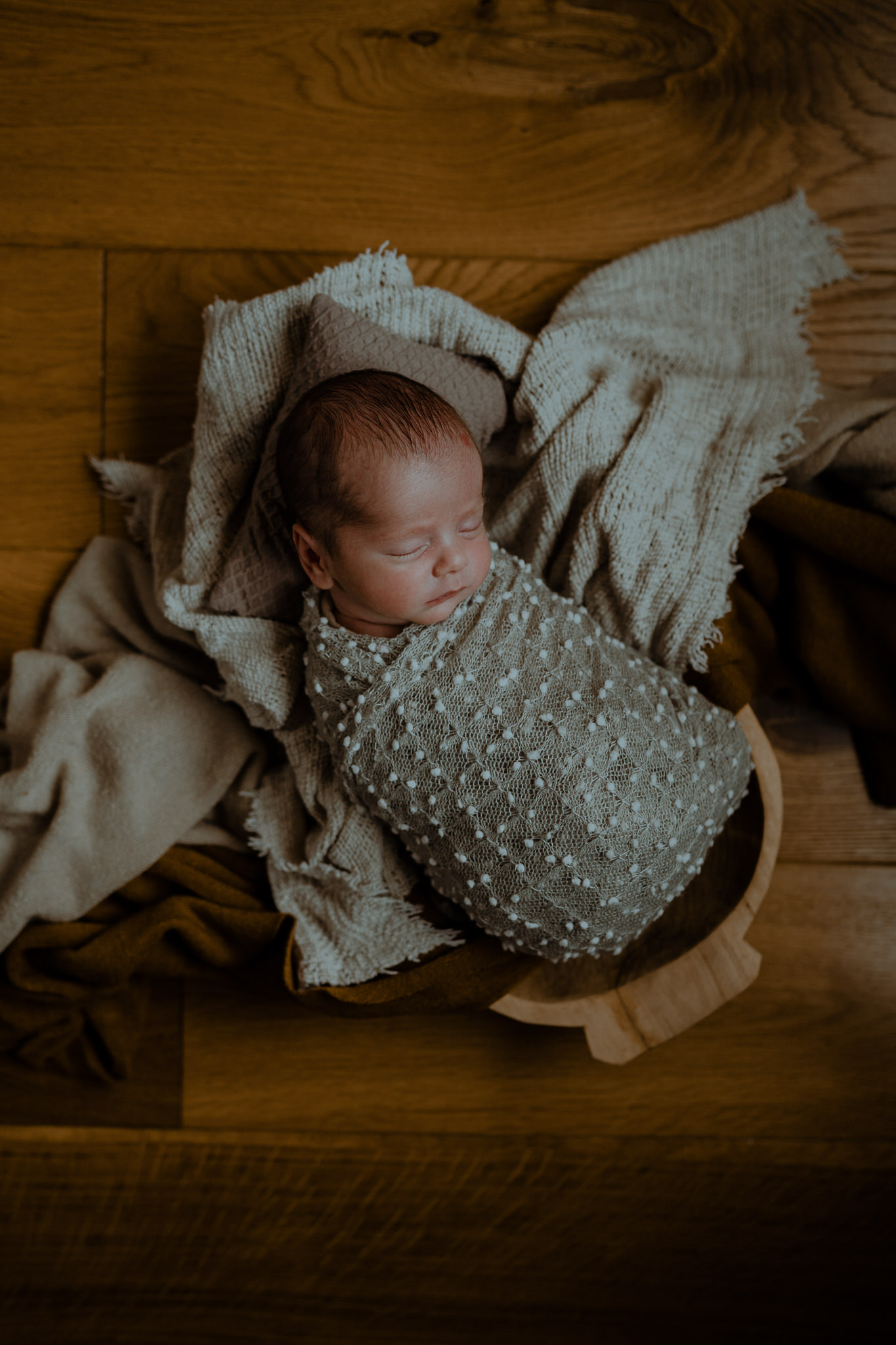 grey and cream styled baby boy in home creative newborn photographer Belfast