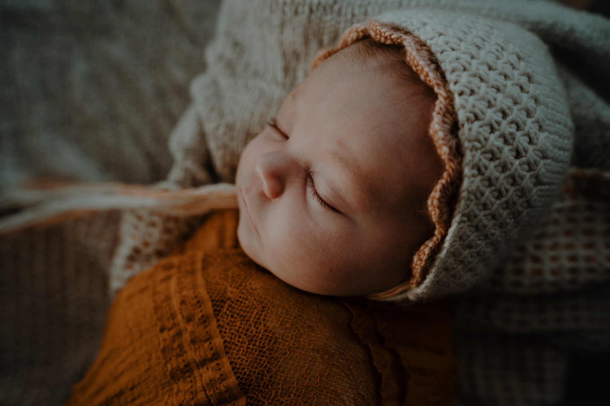 peach cream and rustic tones in home baby girl newborn photography Belfast