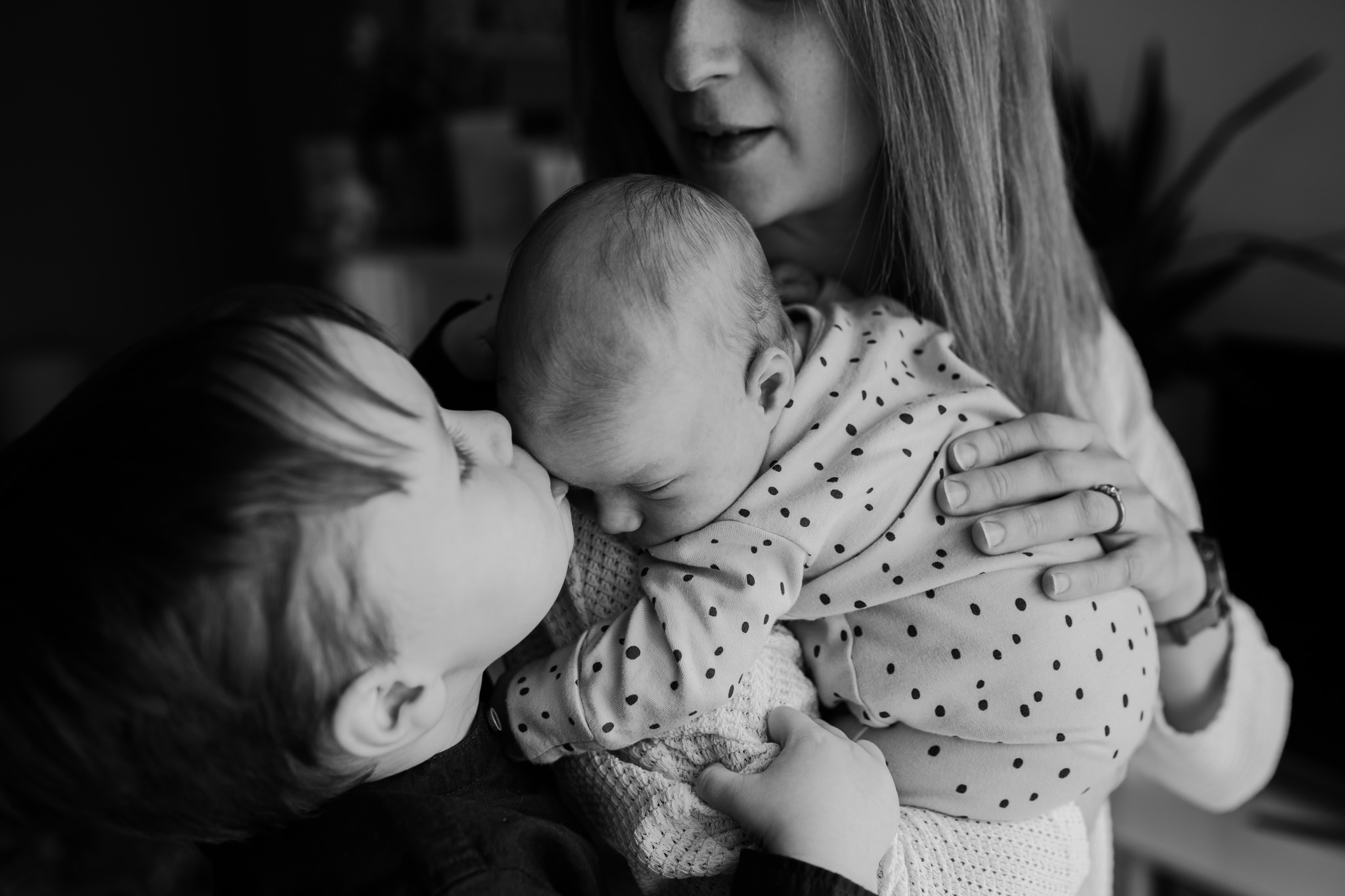 mother son newborn baby girl kiss black and white photoshoot belfast