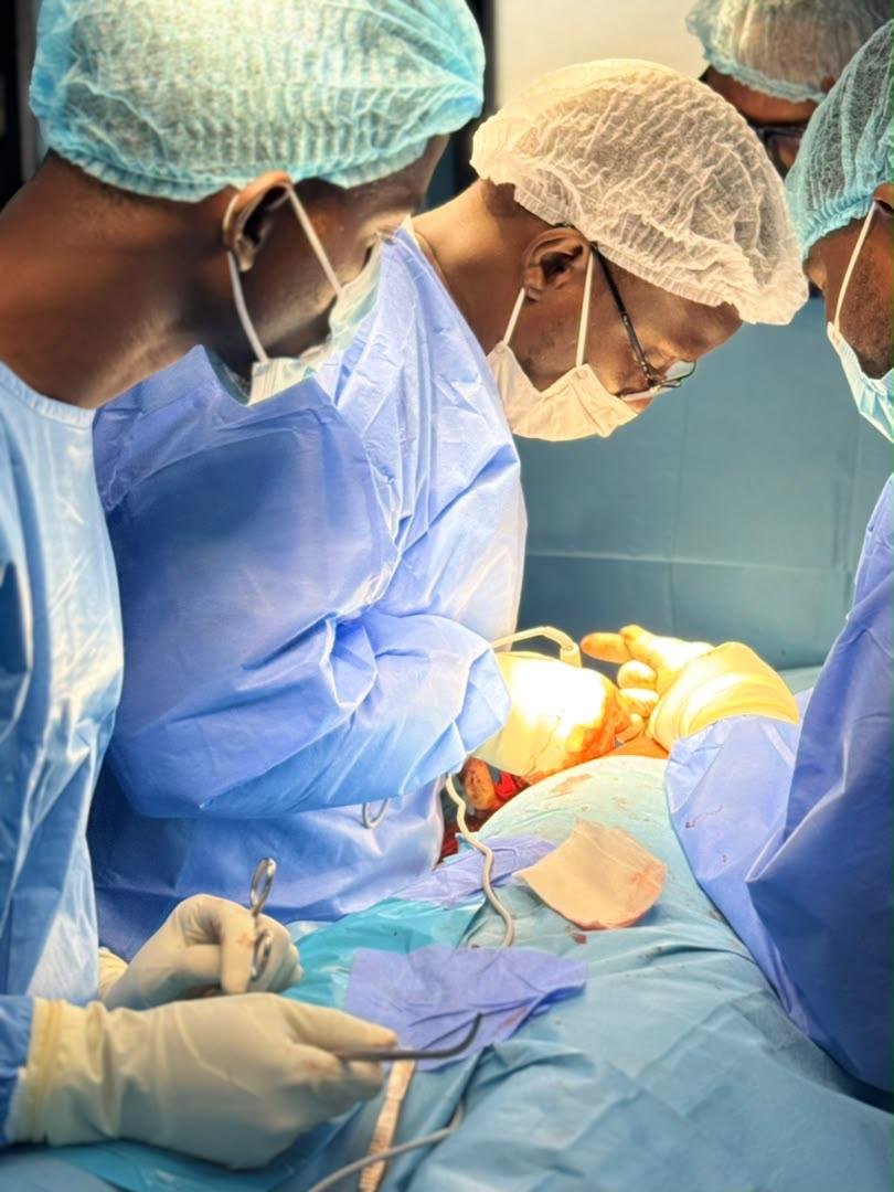 Professor Freddy Gnangnon operating alongside his surgical residents