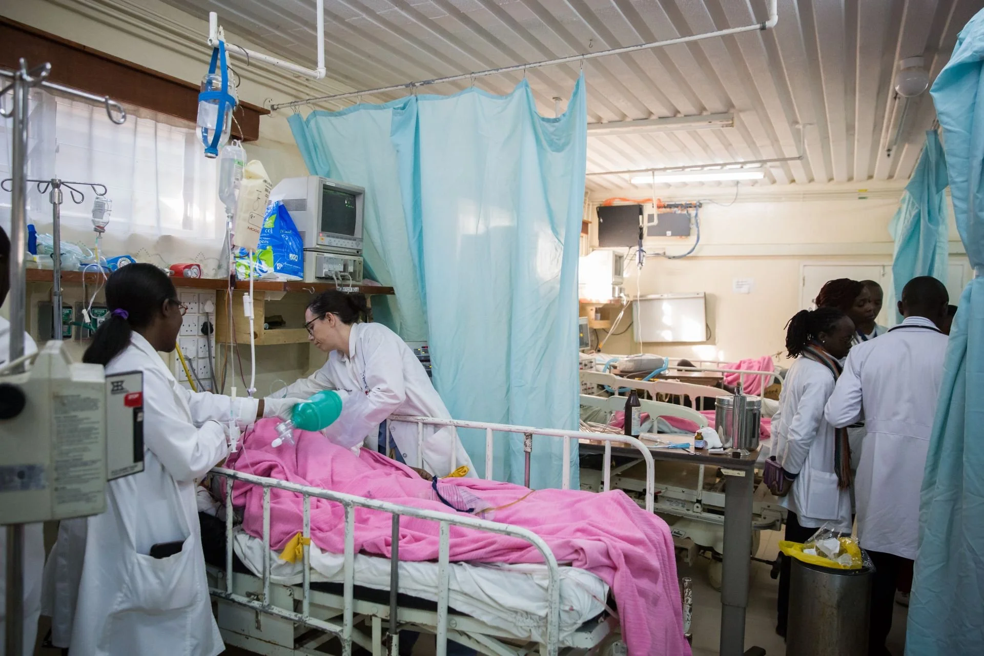 Dr. Andrea Parker at a patient's bedside in the intensive care unit at AGC Tenwek Hospital