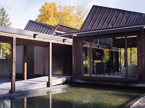 At the Natori Residence in Pound Ridge, designed by Calvin Tsao and Zack McKown, the garden’s water element forms a threshold to the formal entry. Simon Upton Photo