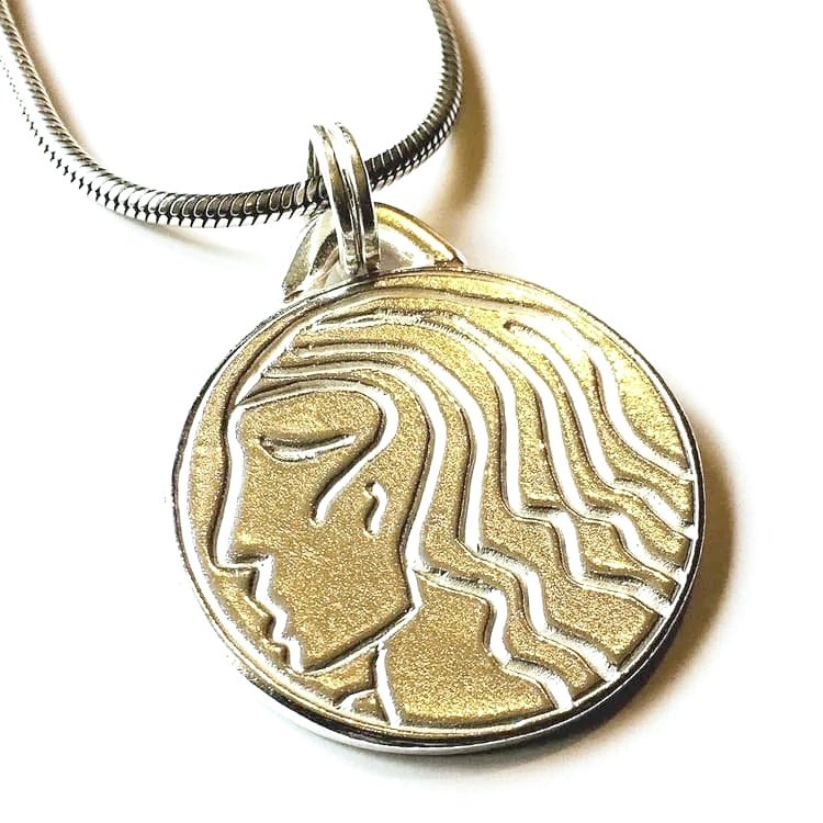 Incised silver pendant