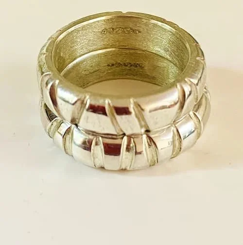 Incised silver band rings
