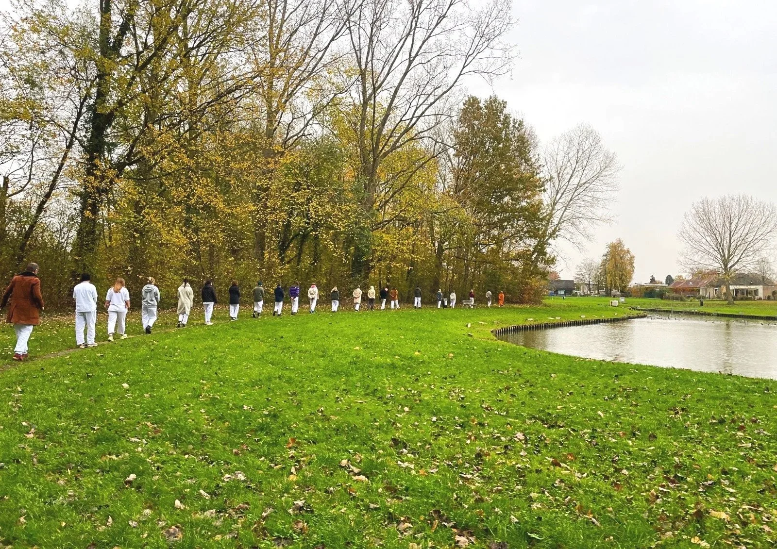 Participants practicing walking meditation during a meditation retreat in Lede.