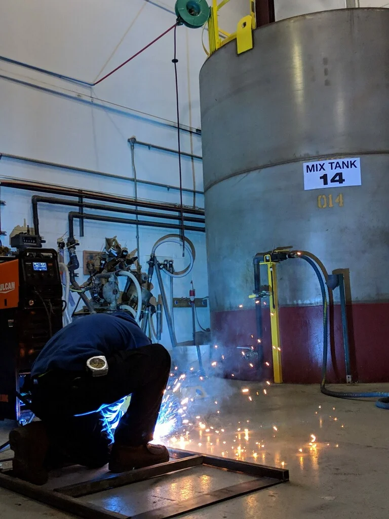 Building swing gates to be welded in place up top of the mix tank you see behind me.