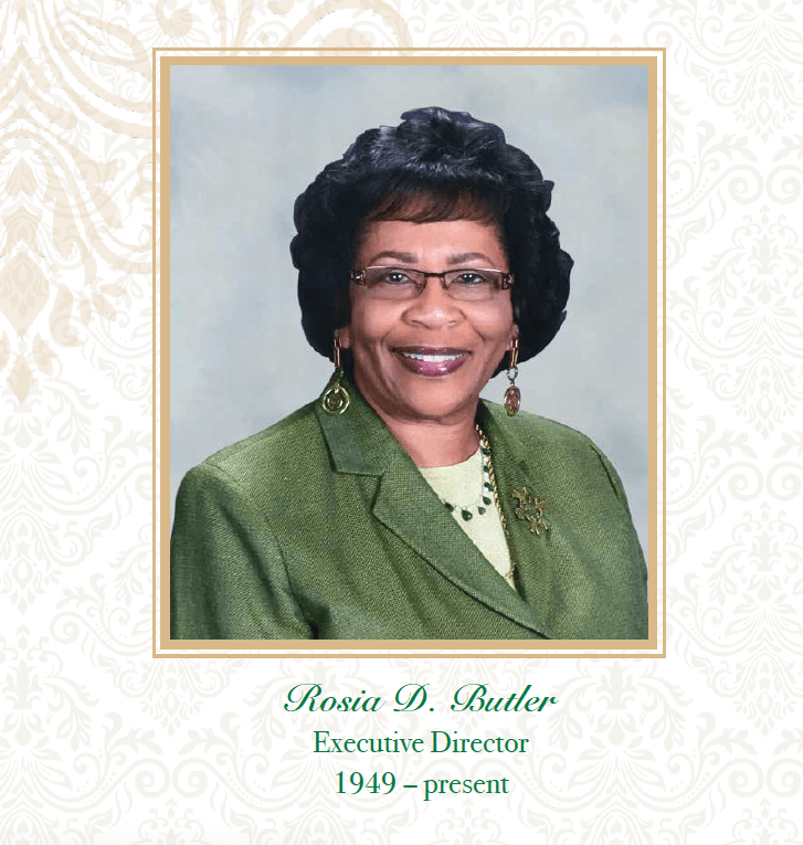 A portrait of Rosa D. Butler, an African American woman smiling, wearing glasses and a green blazer with jewelry, against a light background with a decorative border. Text below indicates she is the Executive Director since 1949.
