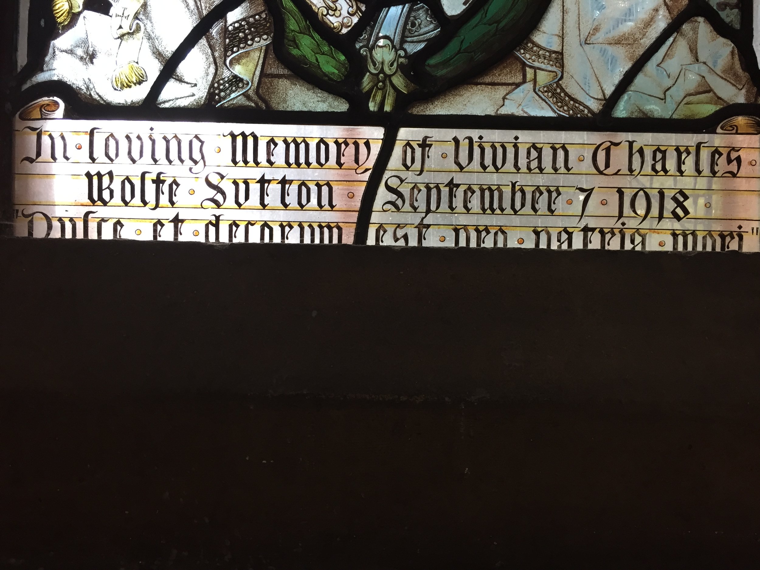 Stained glass window at St Johns sidcup dedicated to Sutton (inscription close up).png