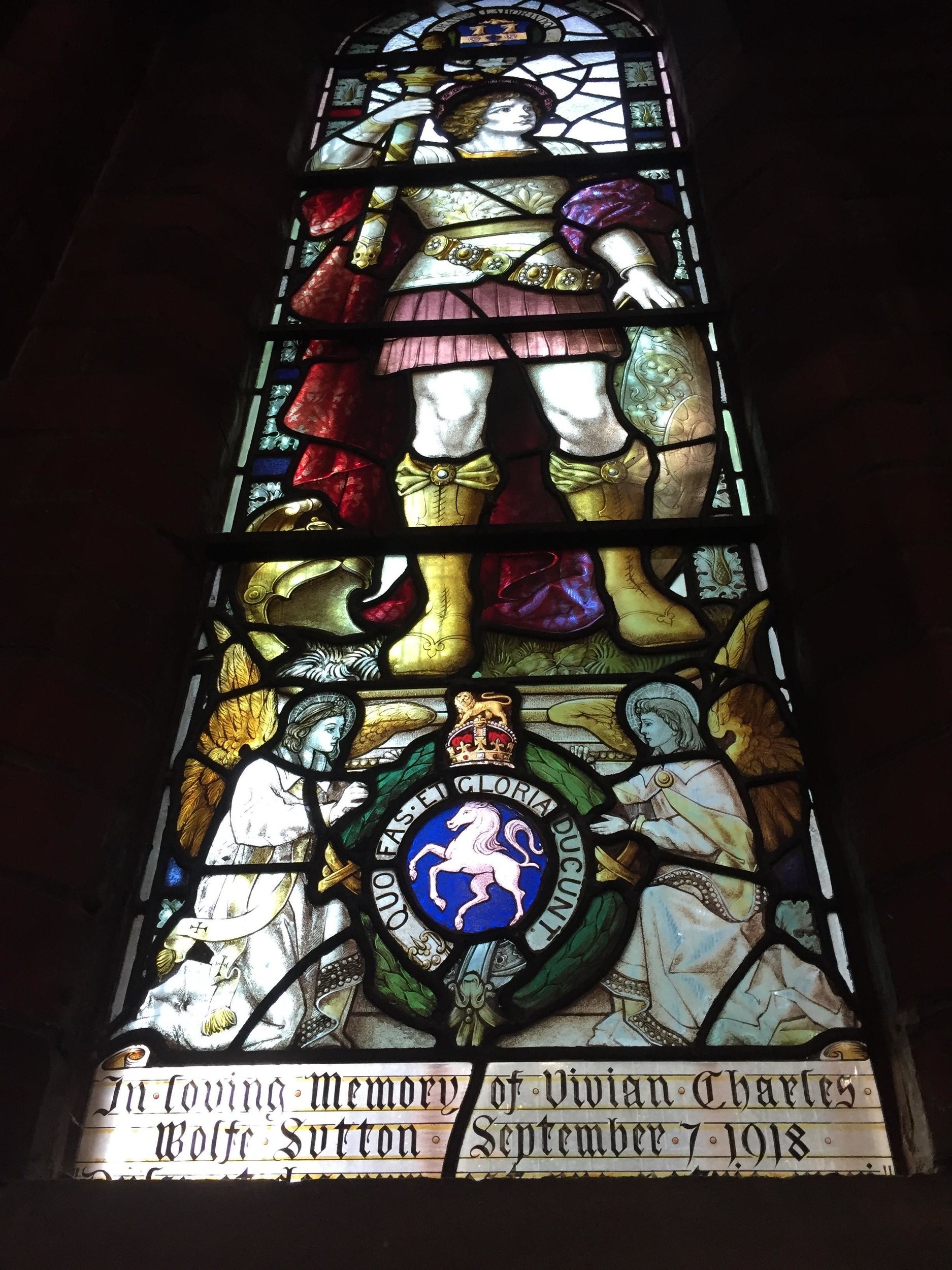 Stained glass window at St Johns sidcup dedicated to Sutton (full length shot).png