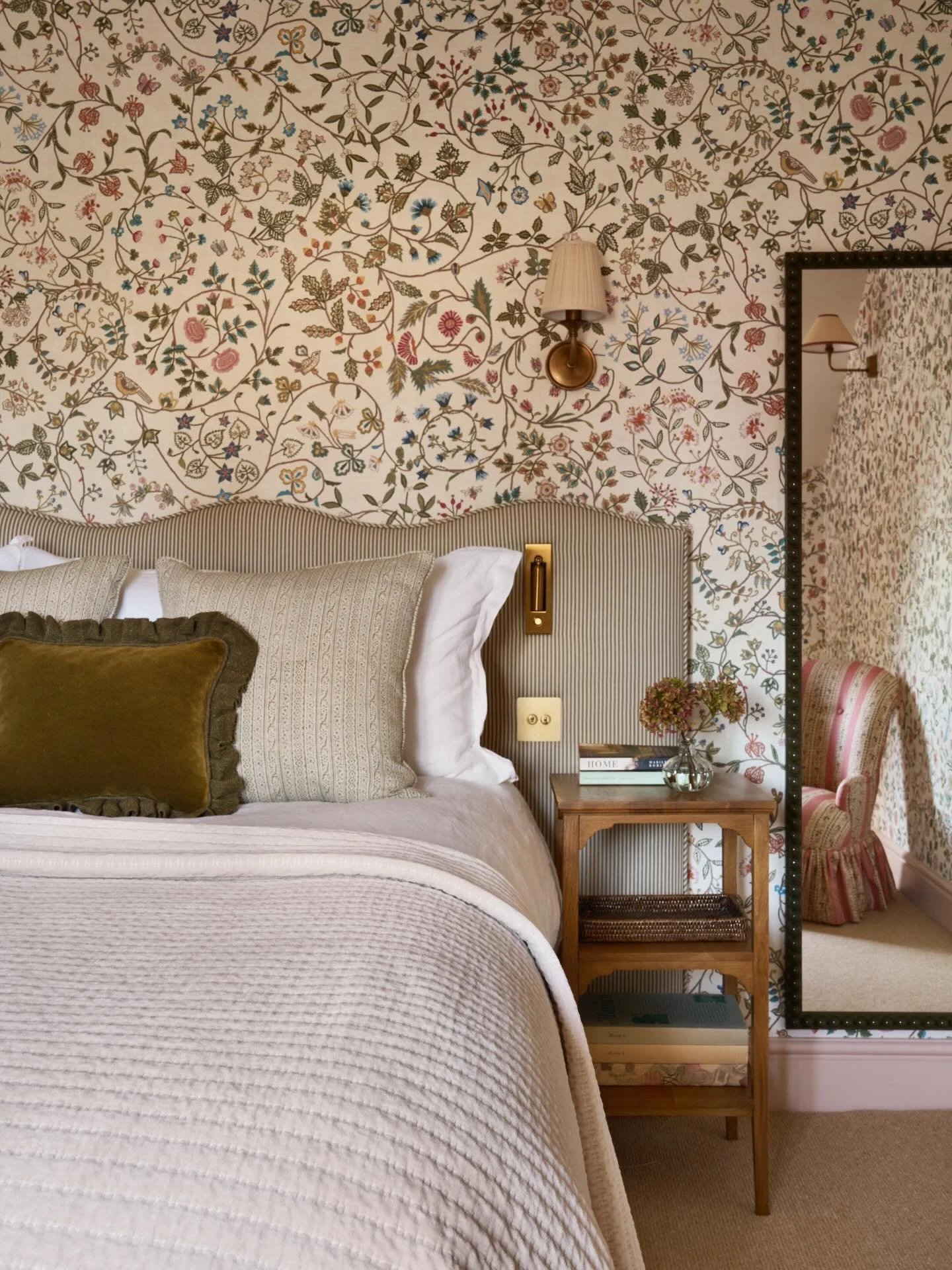 Another shot of this whimsical bedroom from our Surrey cottage project. The @bertolahomestudio mirror gives a glimpse of the cutest bedroom chair in @robertkime Ashoka Stripe. Wallpaper is the wonderful &lsquo;Windrush&rsquo; by @lewisandwood . The b
