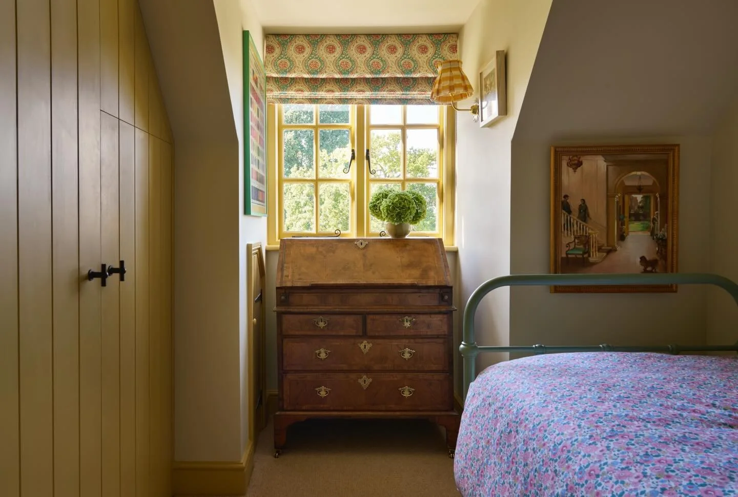 An inspiring, sunny space designed to be a writing room for our clients. I am very vocal about my love of yellow and this room is no exception with woodwork in Sudbury Yellow from @farrowandball 

The room also doubles as a grandchild&rsquo;s room wh